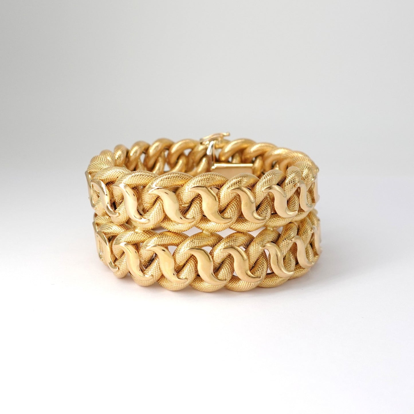 Bracciale a fascia alta intrecciata