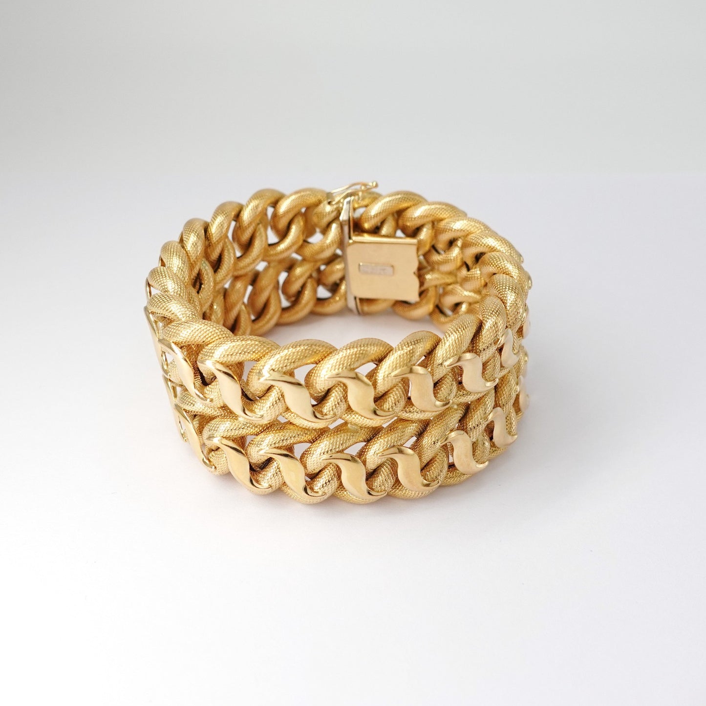 Bracciale a fascia alta intrecciata